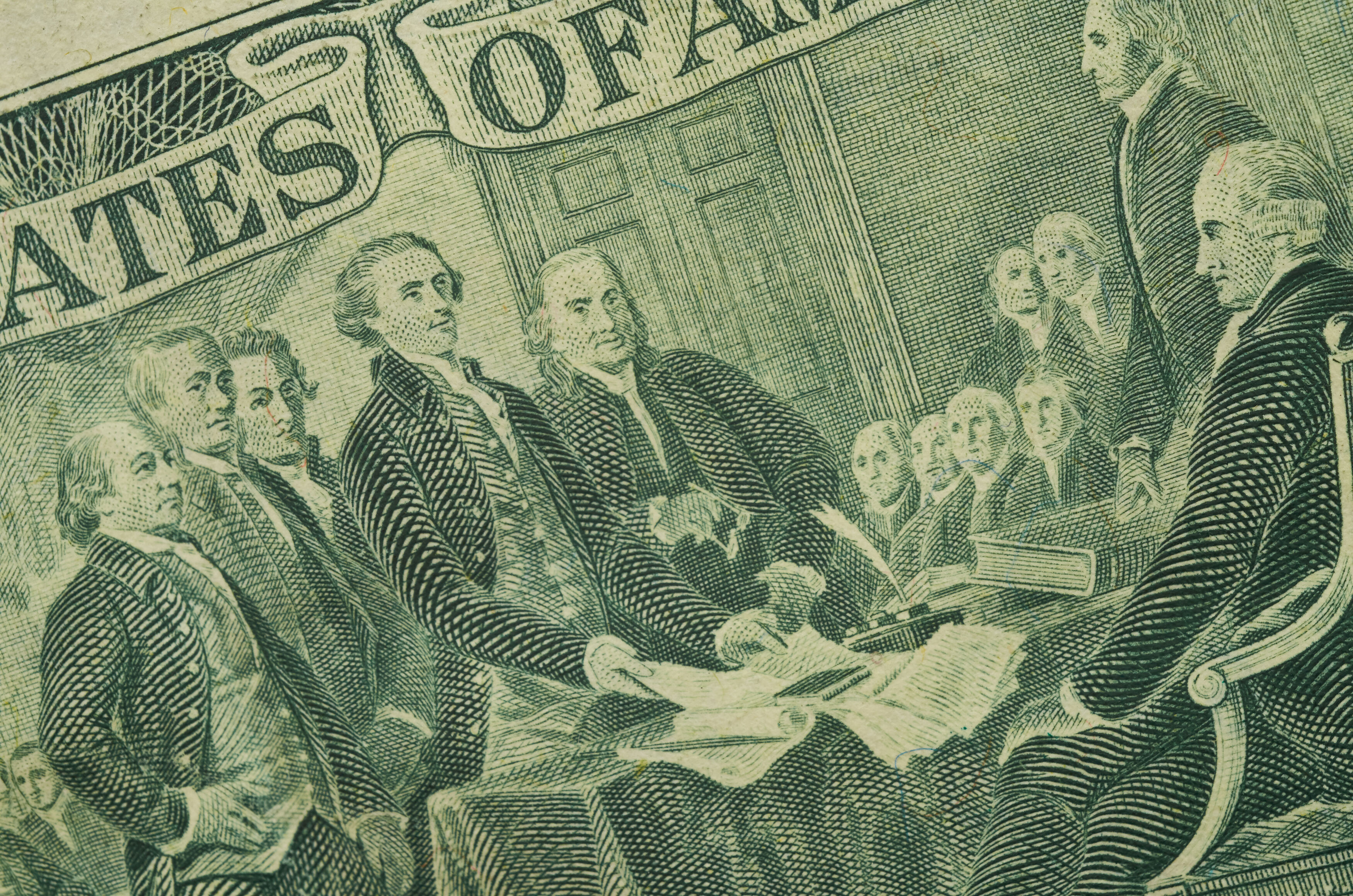 Part of the back of the two-dollar bill showing illustration of dignitaries