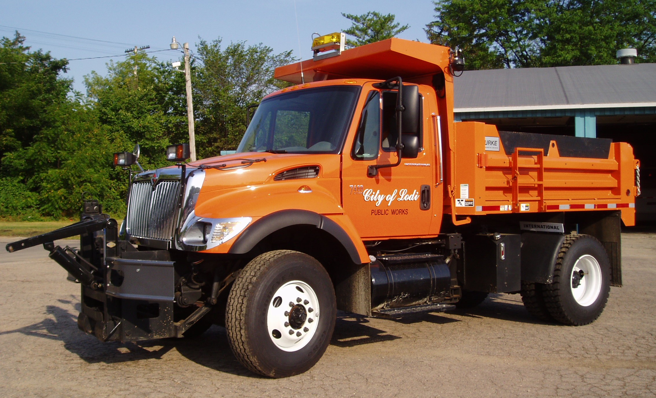 Orange plow truck in the city of Lodi