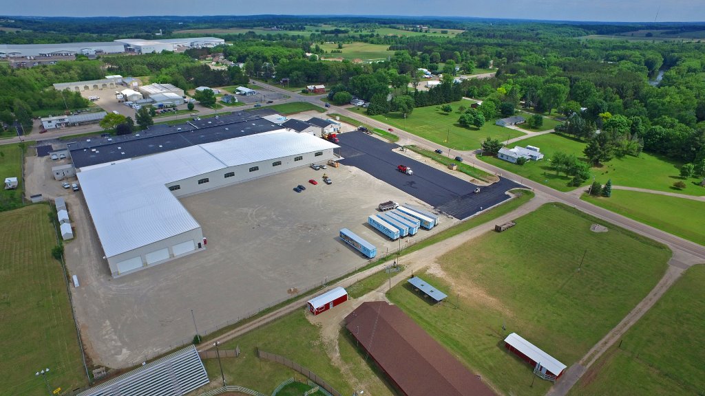 Aerial image of the completed building and parking lot for the Kolbe Window factory expansion in the city of Manawa.