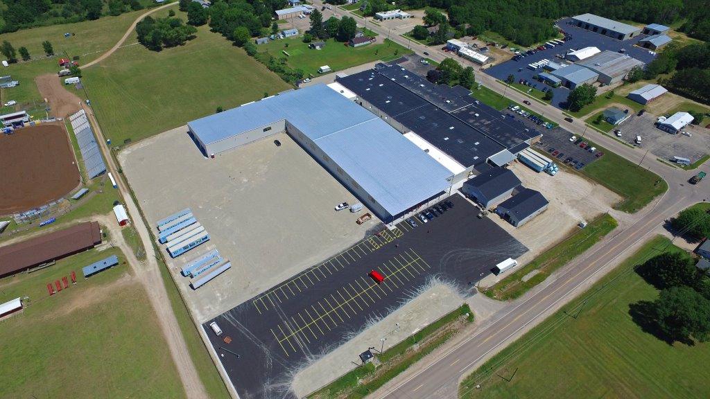 Aerial image of the completed building and parking lot for the Kolbe Window factory expansion in the city of Manawa.