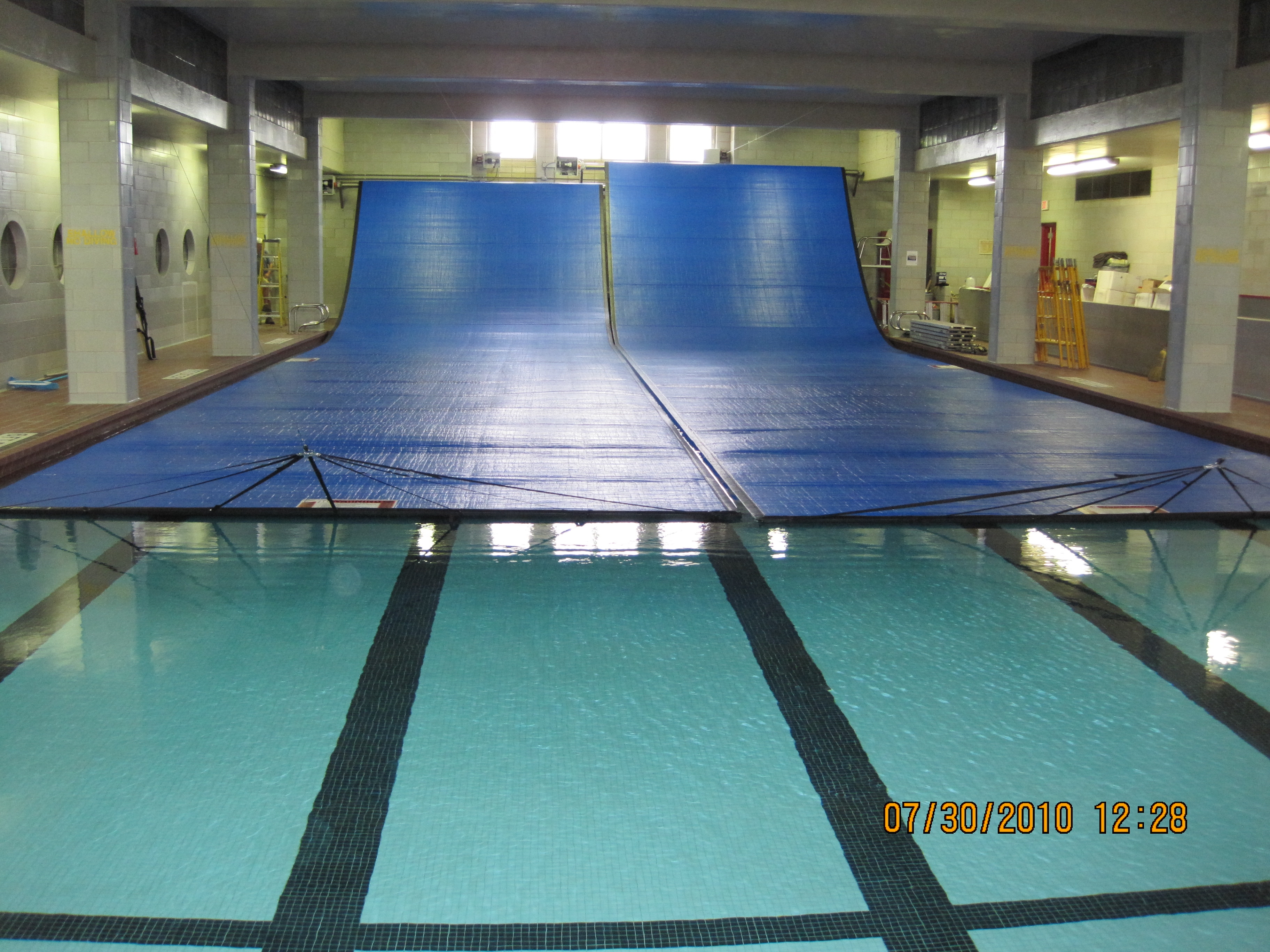 Three lane swimming pool with blue cover built at the Oshkosh School District.