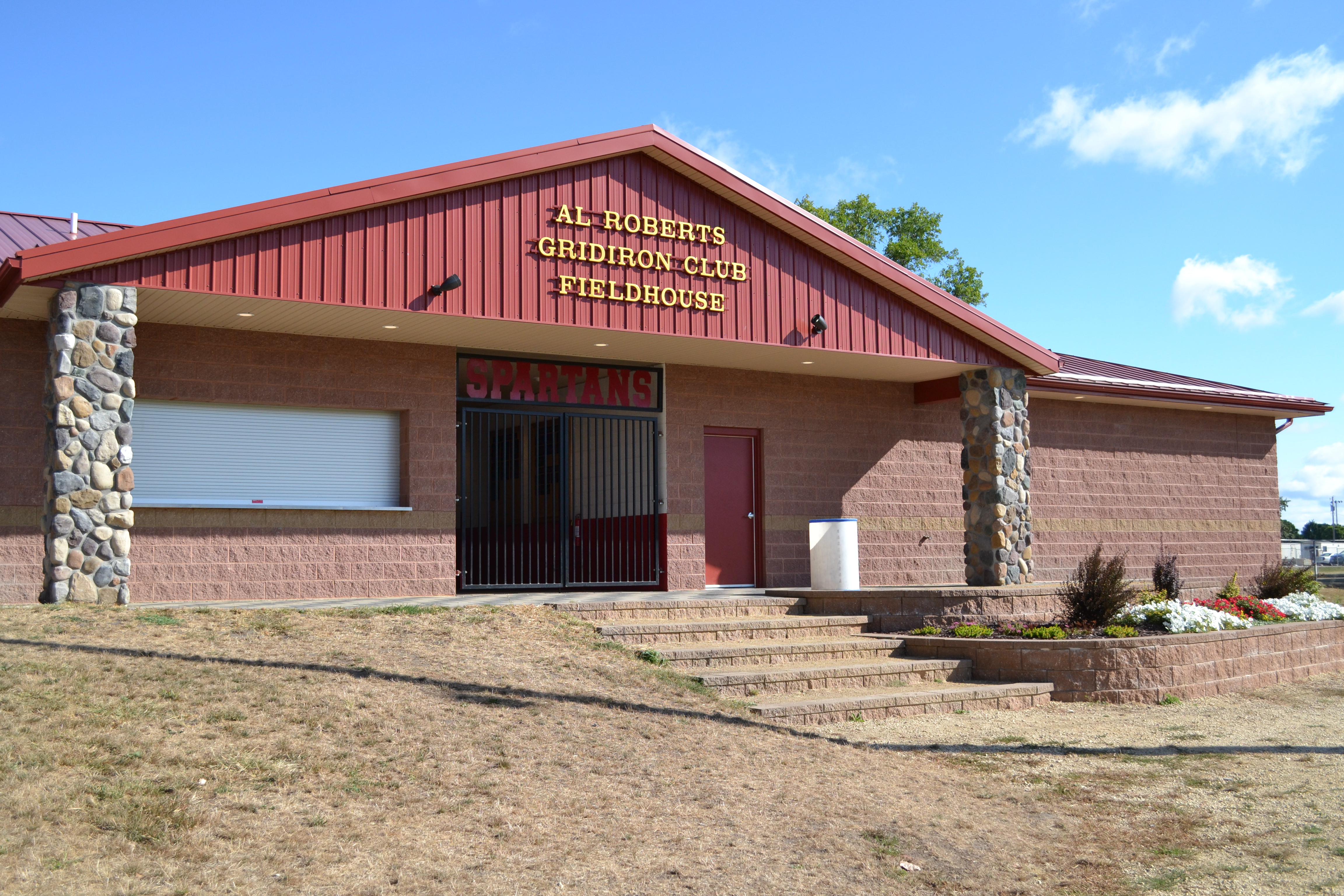 Light red brick Al Roberts Gridiron field house in the Sparta school district.