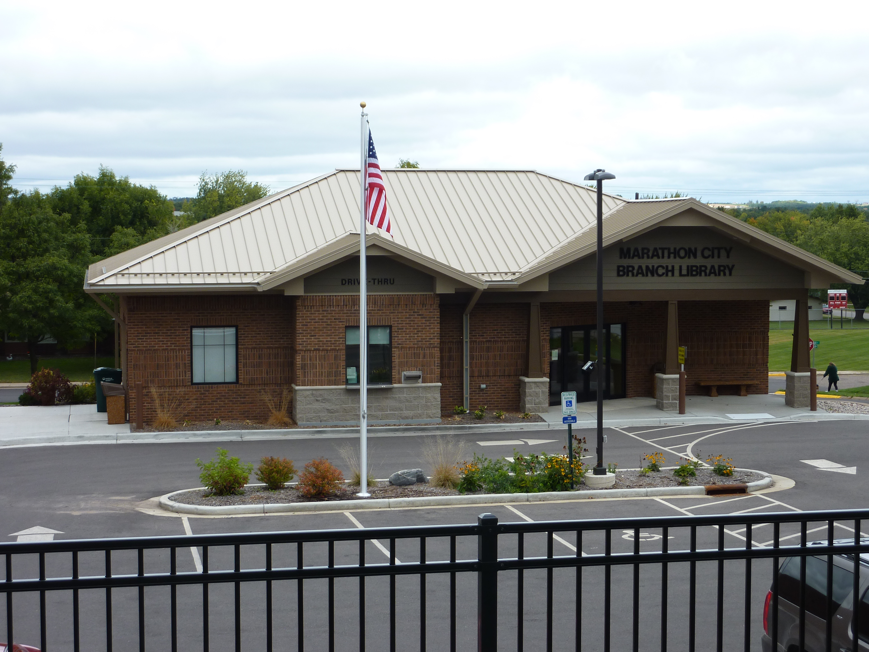 Marathon City branch library.  Brown brick building with tan metal roof.