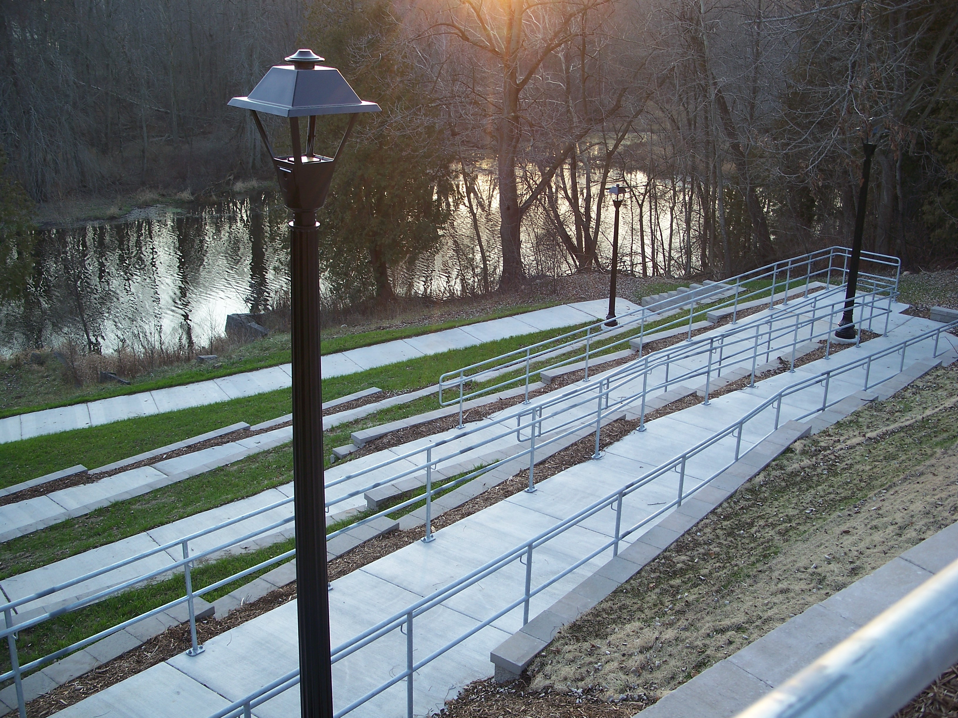Village of Mishicot handicap ramp with several switch backs down to the river viewing platform.