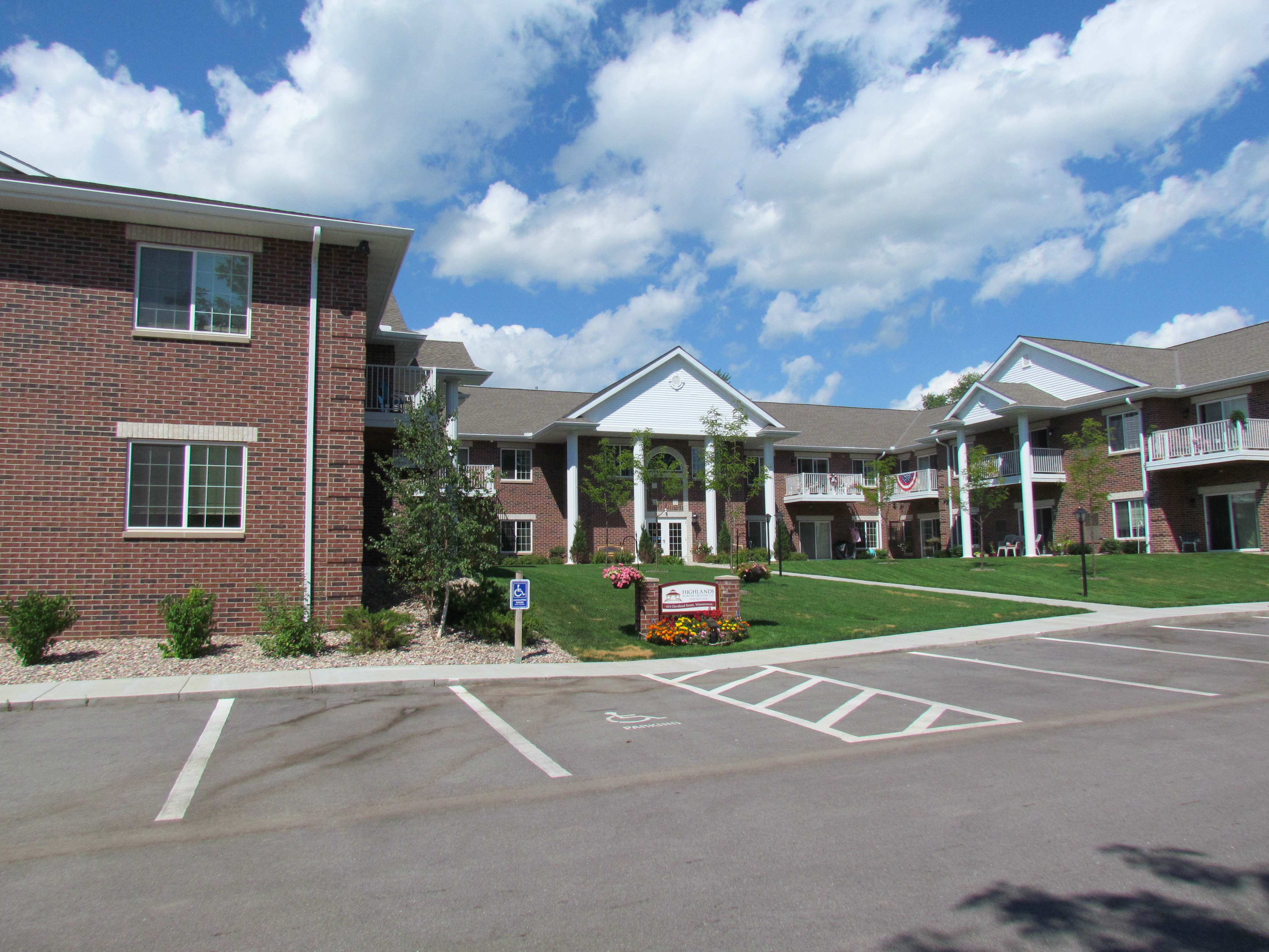 Highlands at River Crossing senior housing project in the Village of Winneconne,  2 story red brick structure with grand 2 story