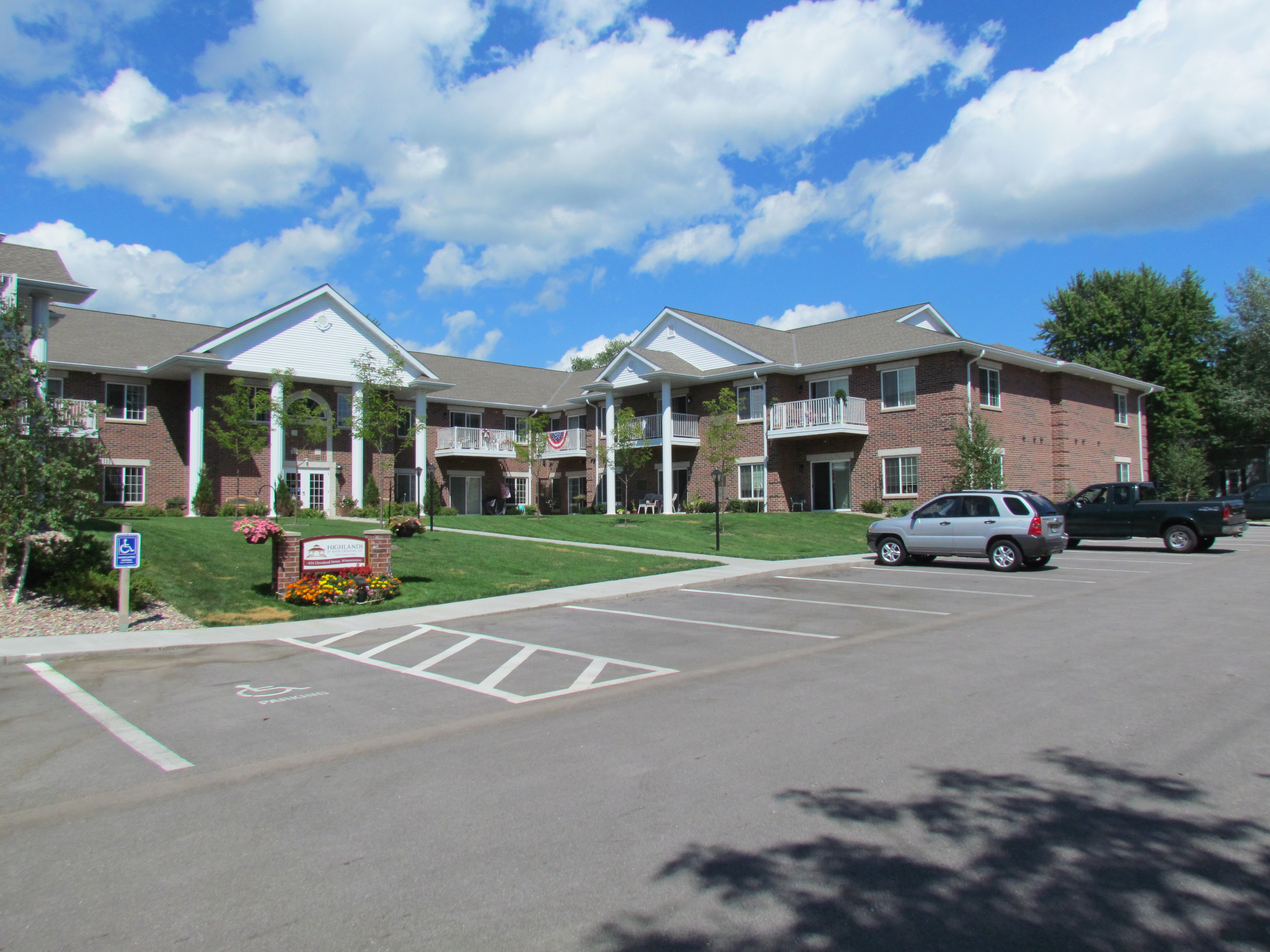 Highlands at River Crossing senior housing project in the Village of Winneconne,  2 story red brick structure with grand 2 story